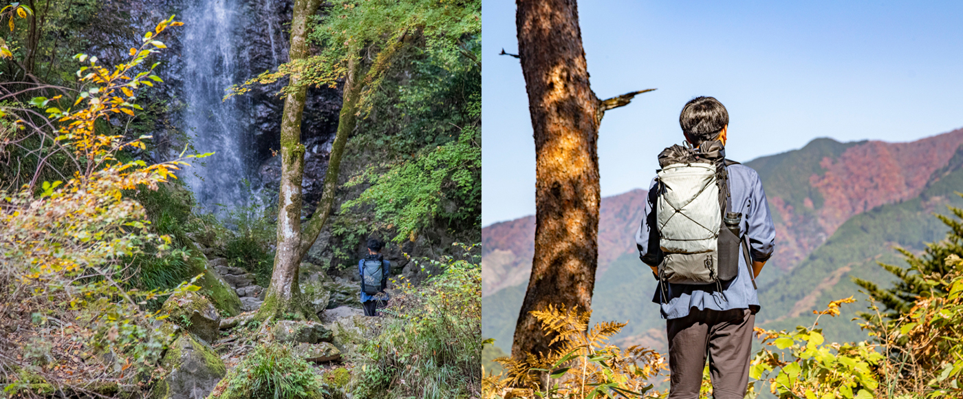開けた登山道から山を眺めるJINさん